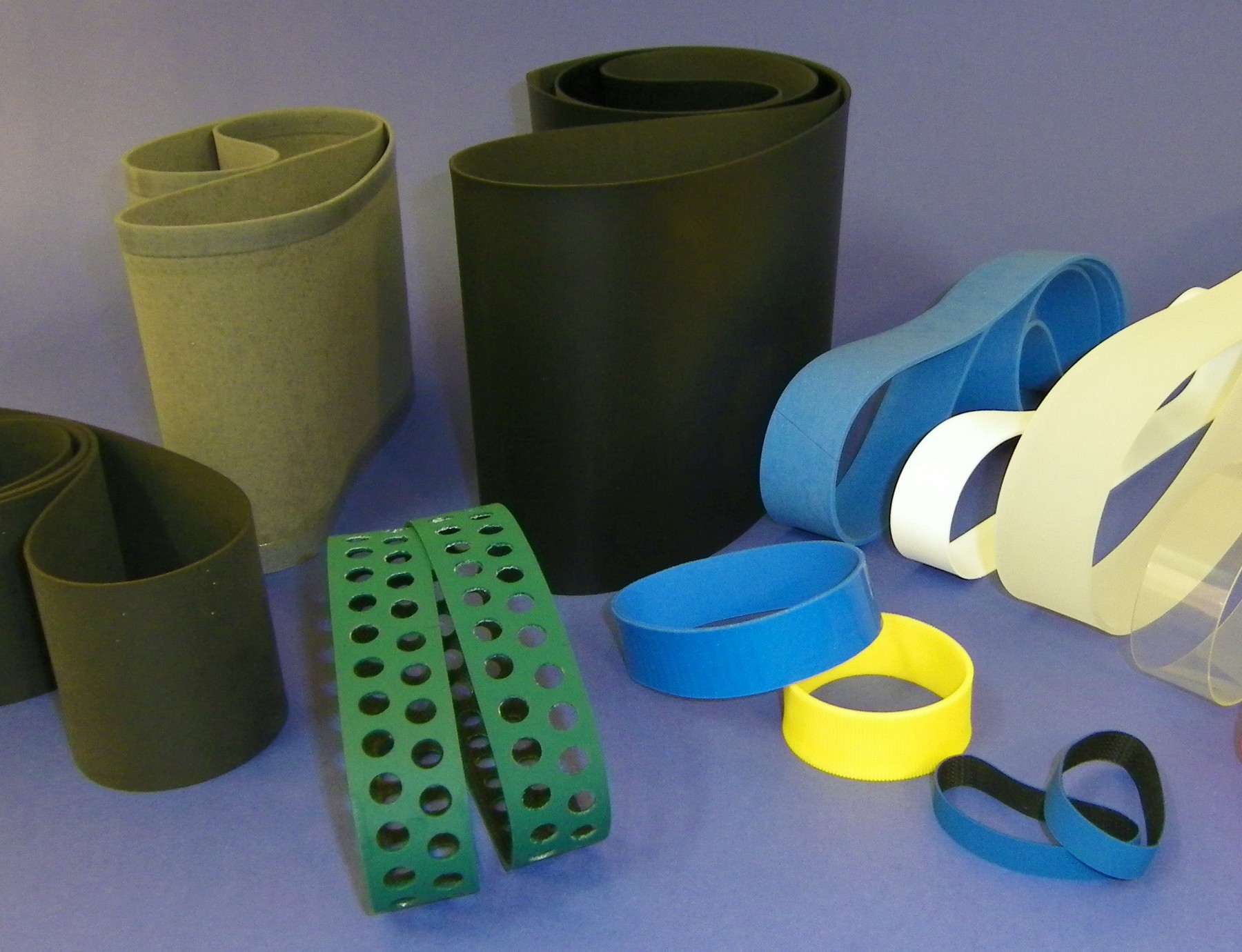 Elastic belt with holes
