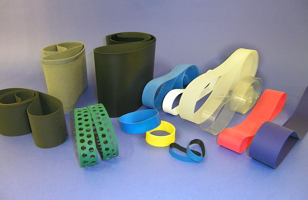 Flat endless elastic belts
